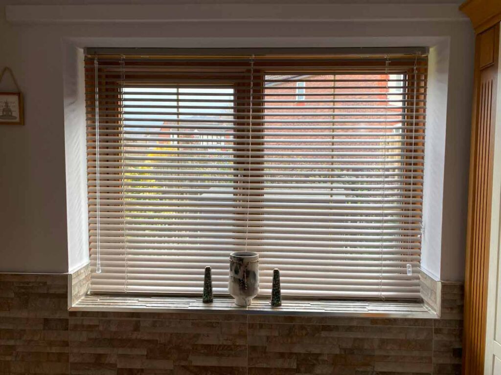 metal venetian blinds in a medium size window