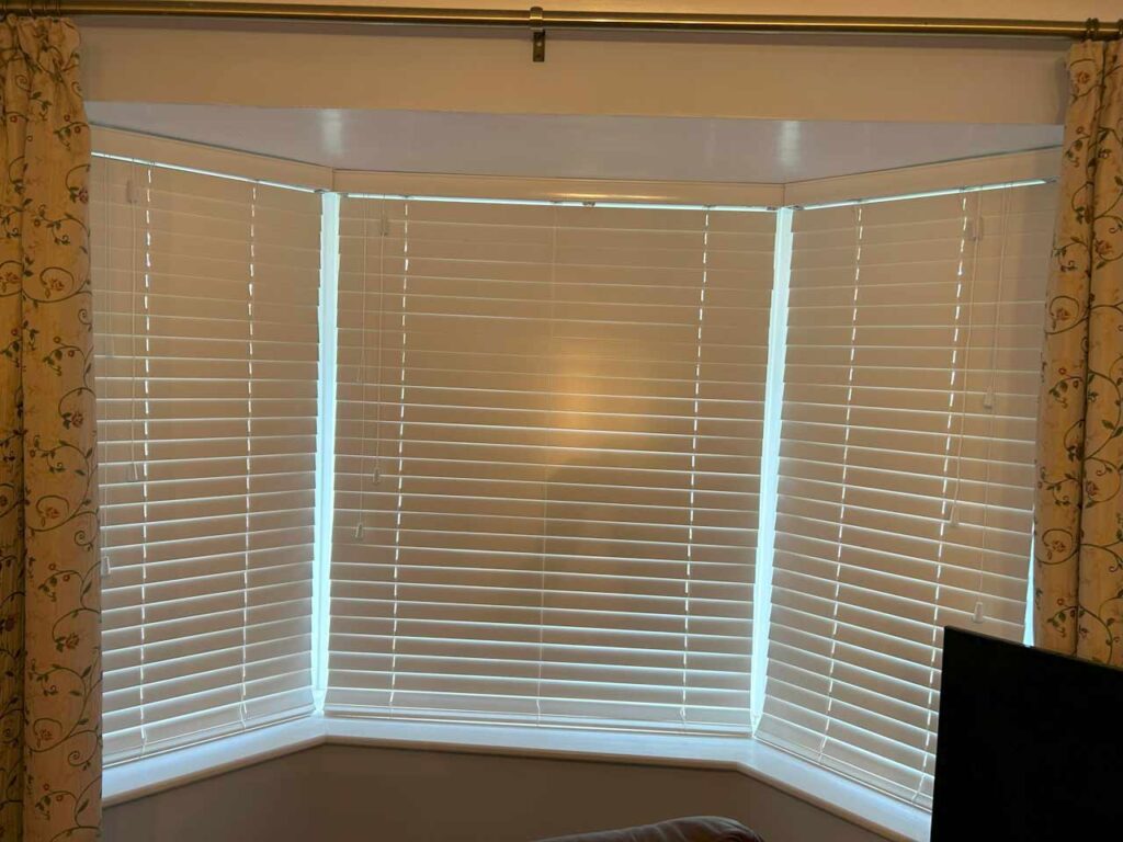 wood venetian blinds in a bay window